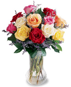 1 or 2 Dozen Roses in a rainbow of colors arrive beautifully arranged with greens in a glass vase. Colors may vary. 